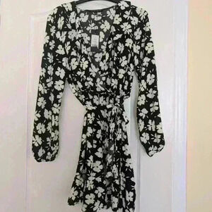 Dynamite size Medium Long sleeve black with white flowers  dress